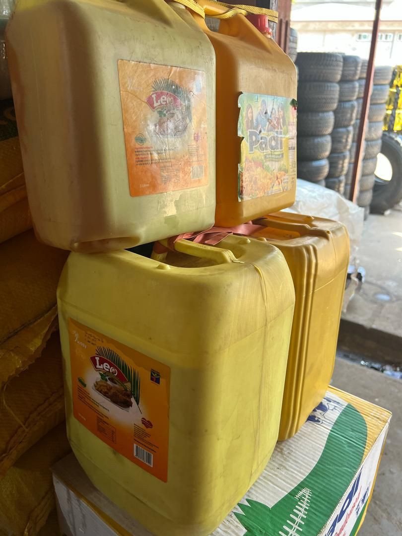 Large containers of cooking oil ready to donate