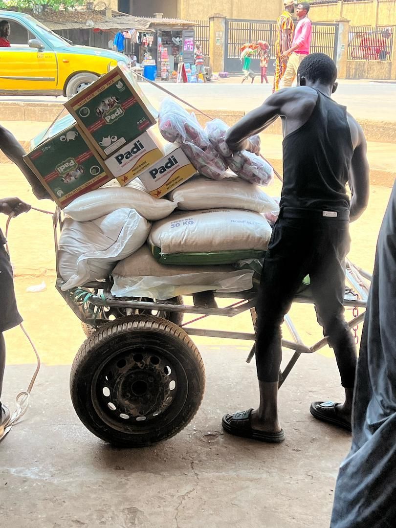 Sacks of rice and boxes loaded on a cart for delivery