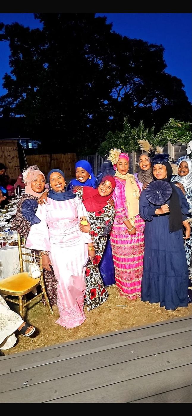 A group of members at a night-time outdoor event