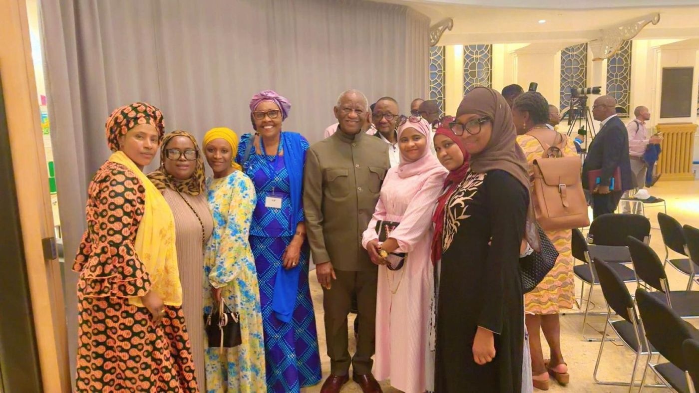 Members with guests at an indoor community event