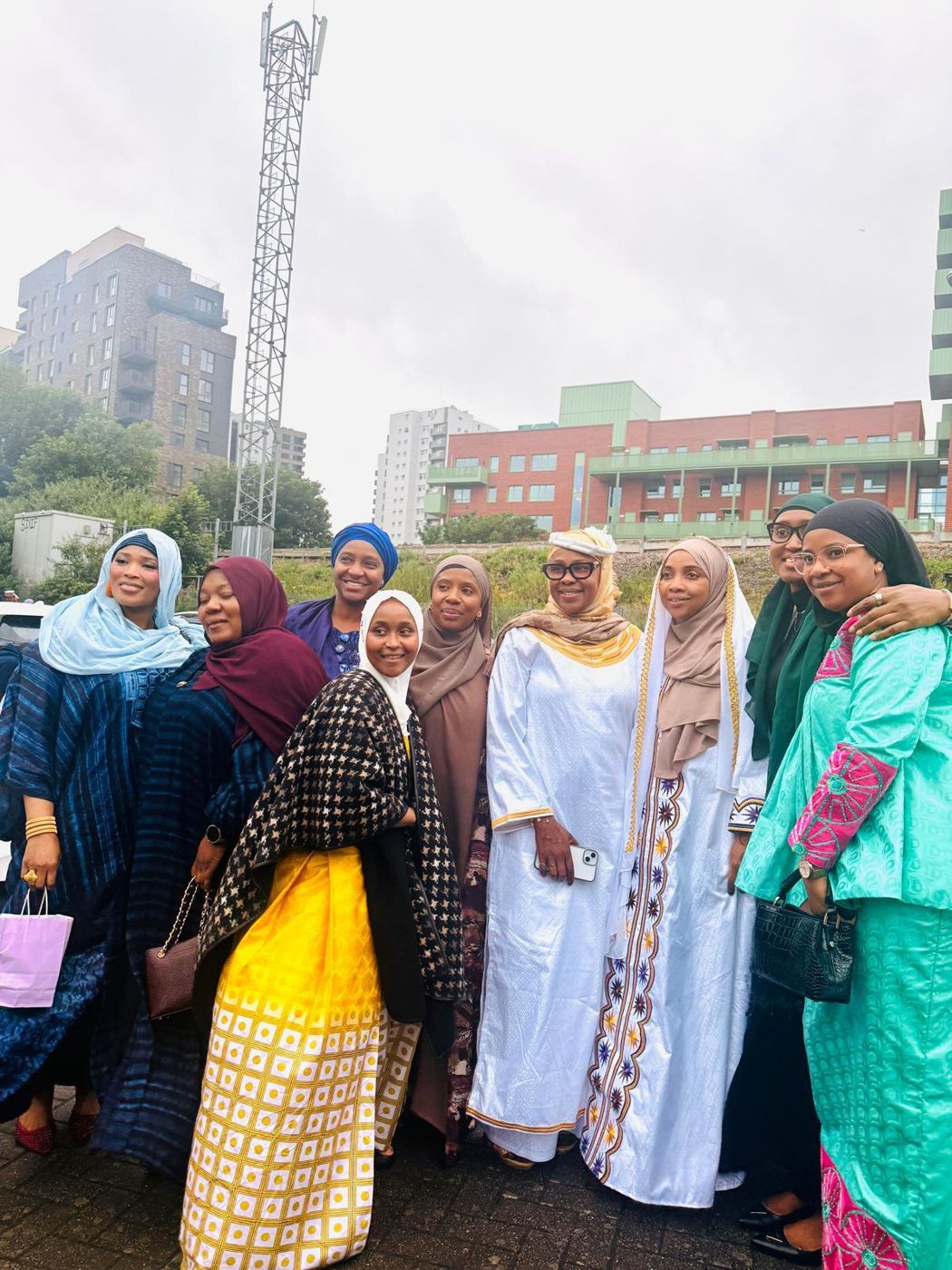 Members smiling together at an outdoor gathering