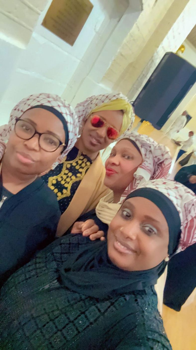 Members taking a joyful group selfie